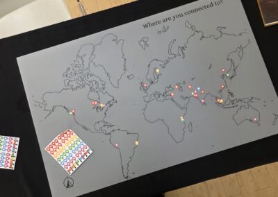 "Where are you connected to?" world map marked with stickers by guests